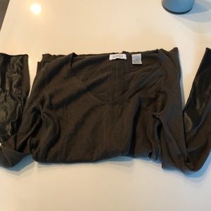 Barney’s dark green sweater with leather trim